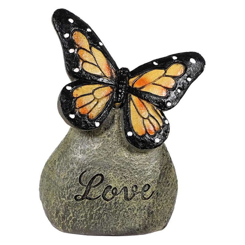 Yellow Butterfly On “Love” Stone